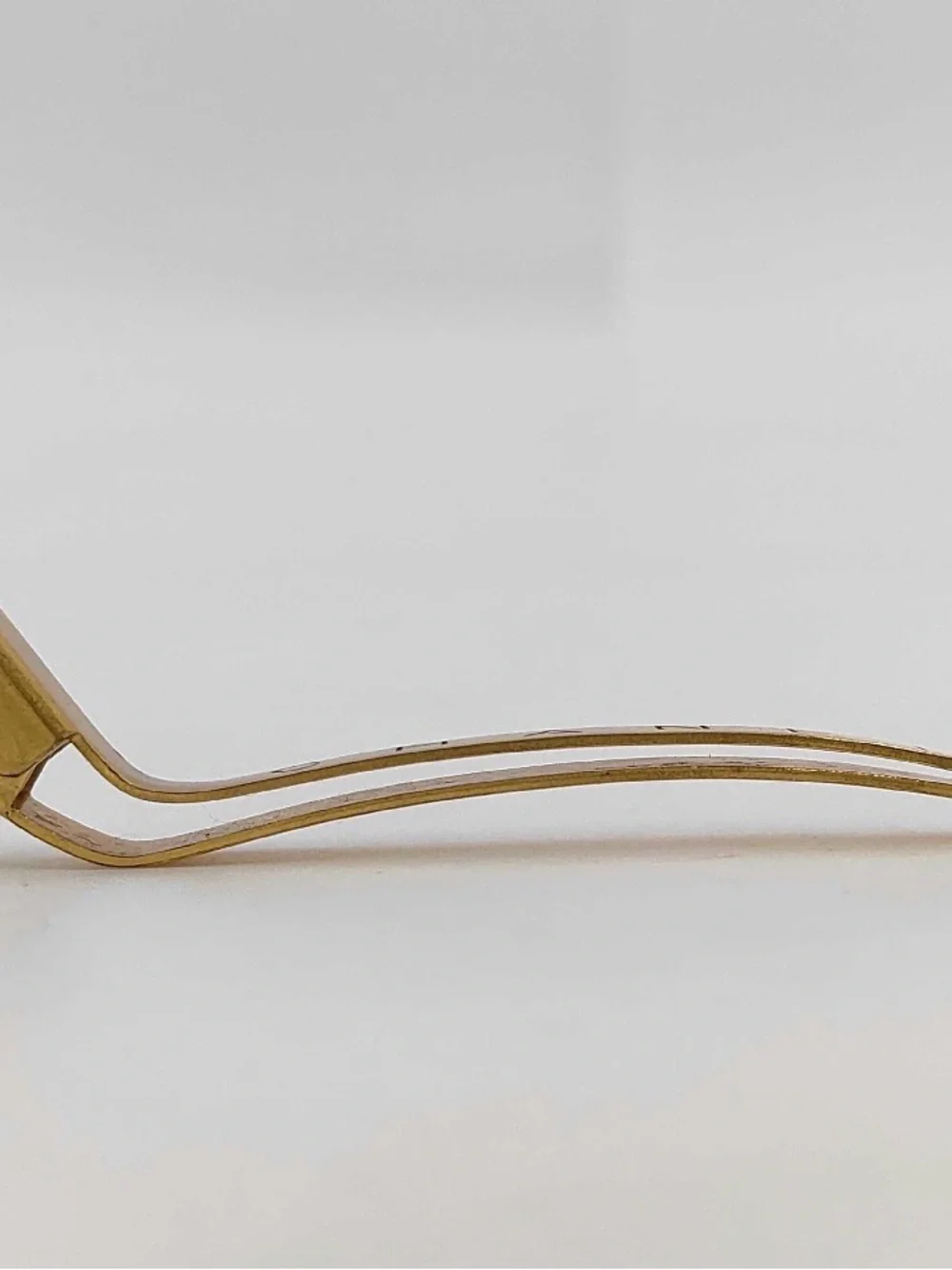 CHANEL Gold Tone Logo Hair Barrette